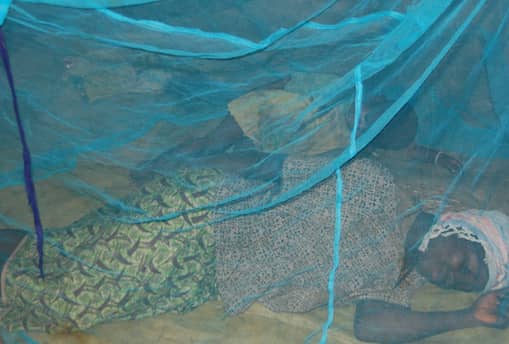 Woman sleeping inside a net