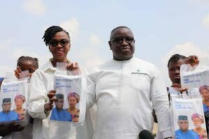 President Bio and wife displaying sanitary pads. Photo Credit-State House Communications.