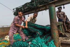 Chinese fishermen facing inspectors at sea. Photo Credit, Pierre Gliezes_Green Peace