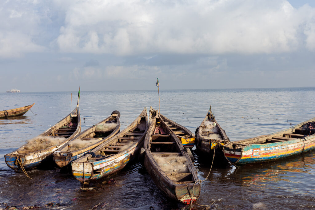 Local canoes at the shore in Moa Wharf, Eastern Freetown. Photo Credit-Larry Tucker/Engage Salone.