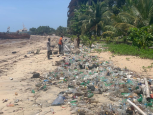 A pile of plastic rubbish lies around Lumley Beach. Photo Credit: Ibrahim Mansaray/Engage Salone.